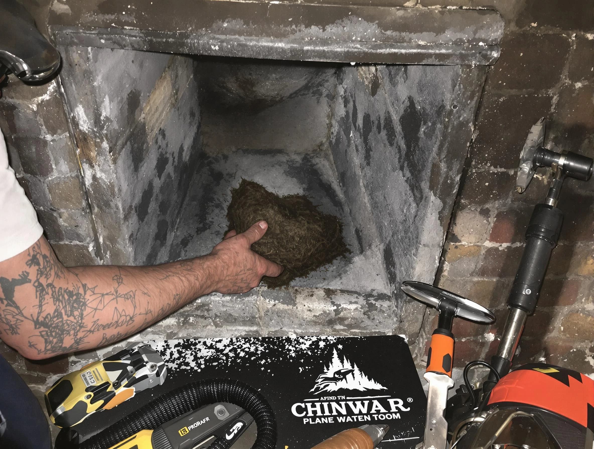 Duluth Chimney Sweep safely removing debris and screening chimney in Duluth, GA